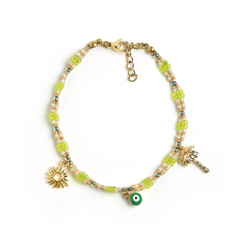 Beaded bracelet with charms on a white background